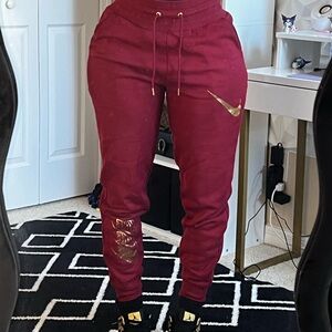Nike Maroon Sweatpants/Joggers with Metallic Gold Details